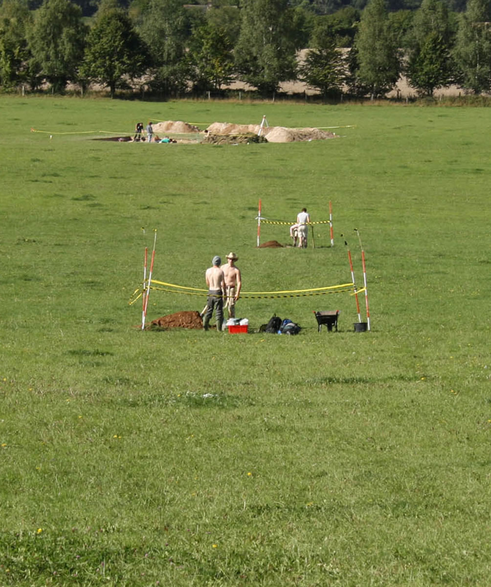 Some of Kate&rsquo;s test pits, as viewed from Pegasus Barrow, with the Area E trench in the distance.